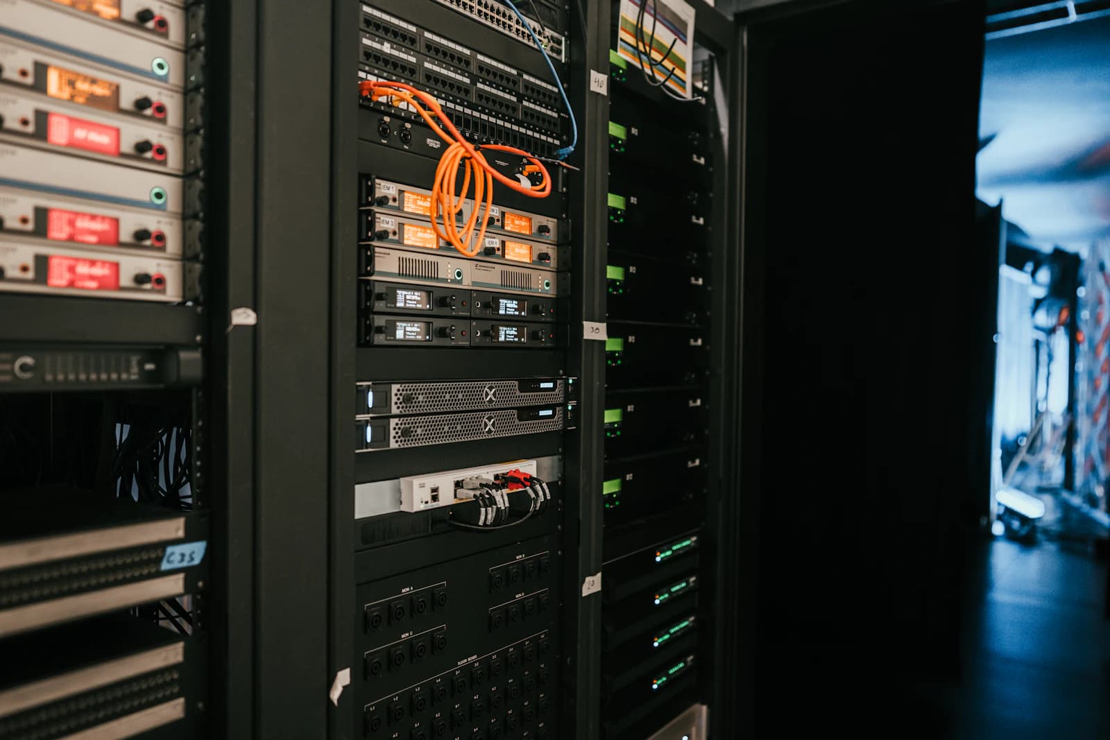 Network cables plugged into servers in a data center rack